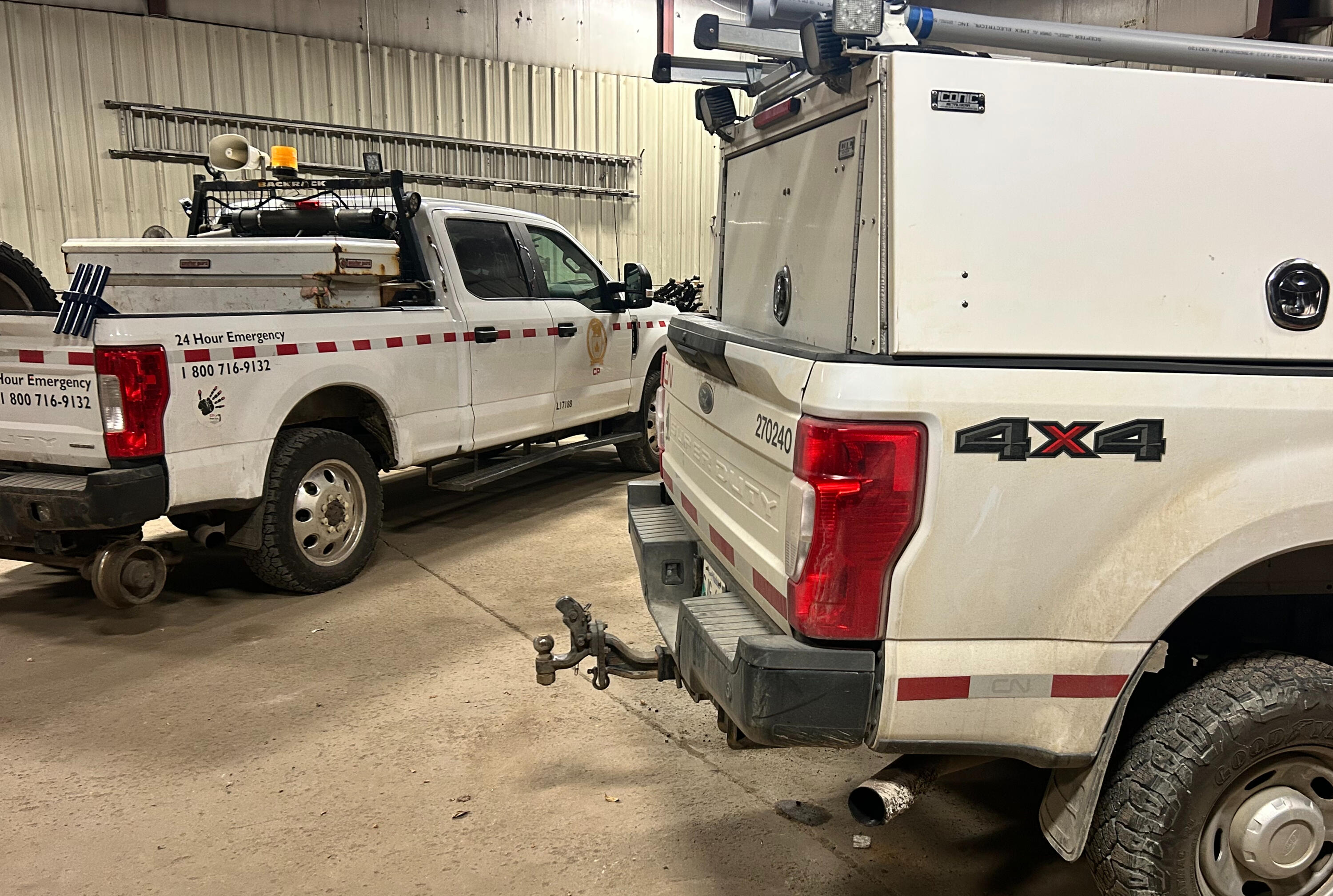 Hi-Rail service trucks undergoing suspension maintenance and load support upgrades at Standard Auto Spring Works in Winnipeg. Specialized suspension solutions for rail service vehicles, fleet trucks, and Hi-Rail equipment.