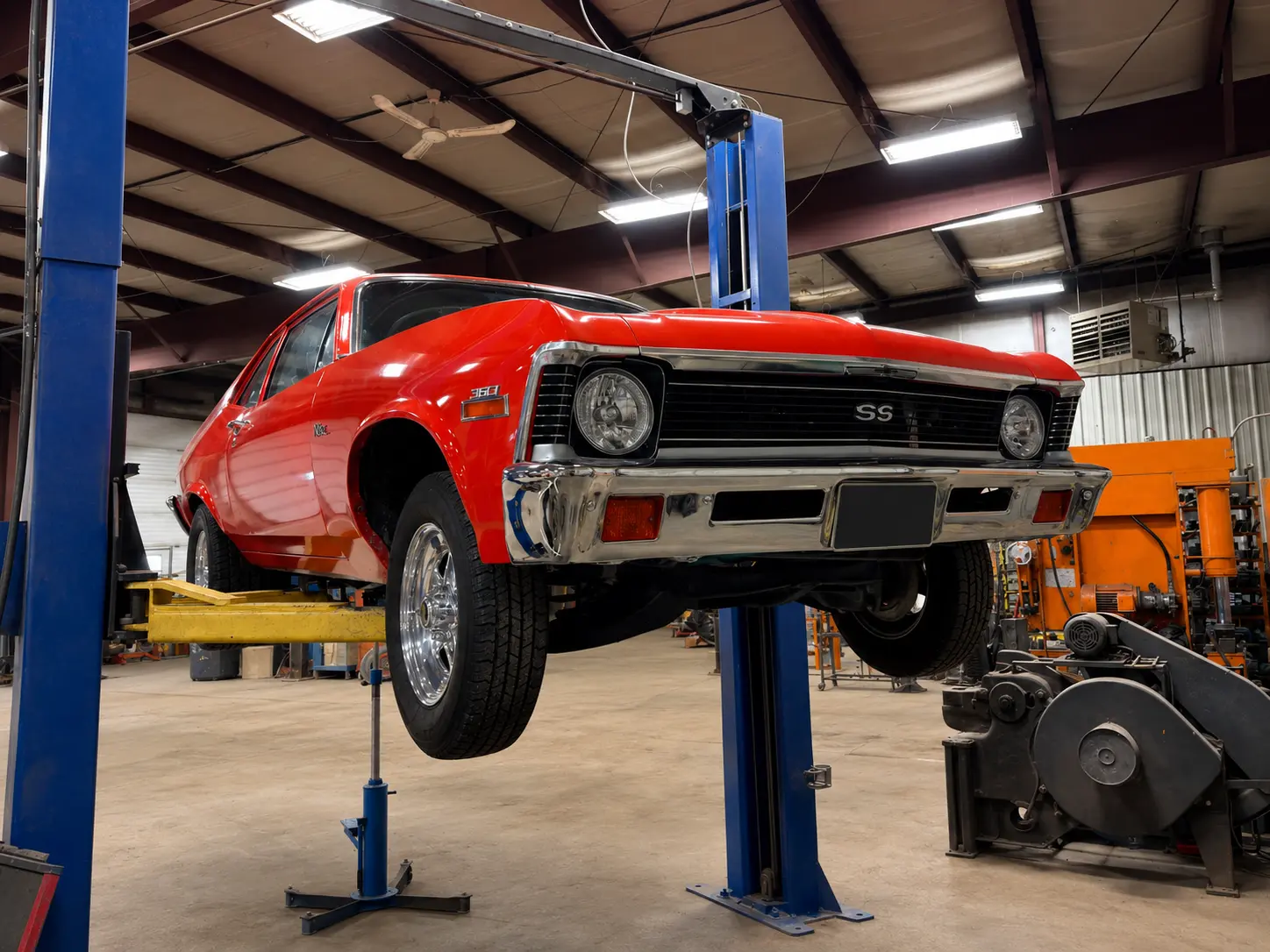 Classic vehicle raised inside the Standard Auto Spring Works shop