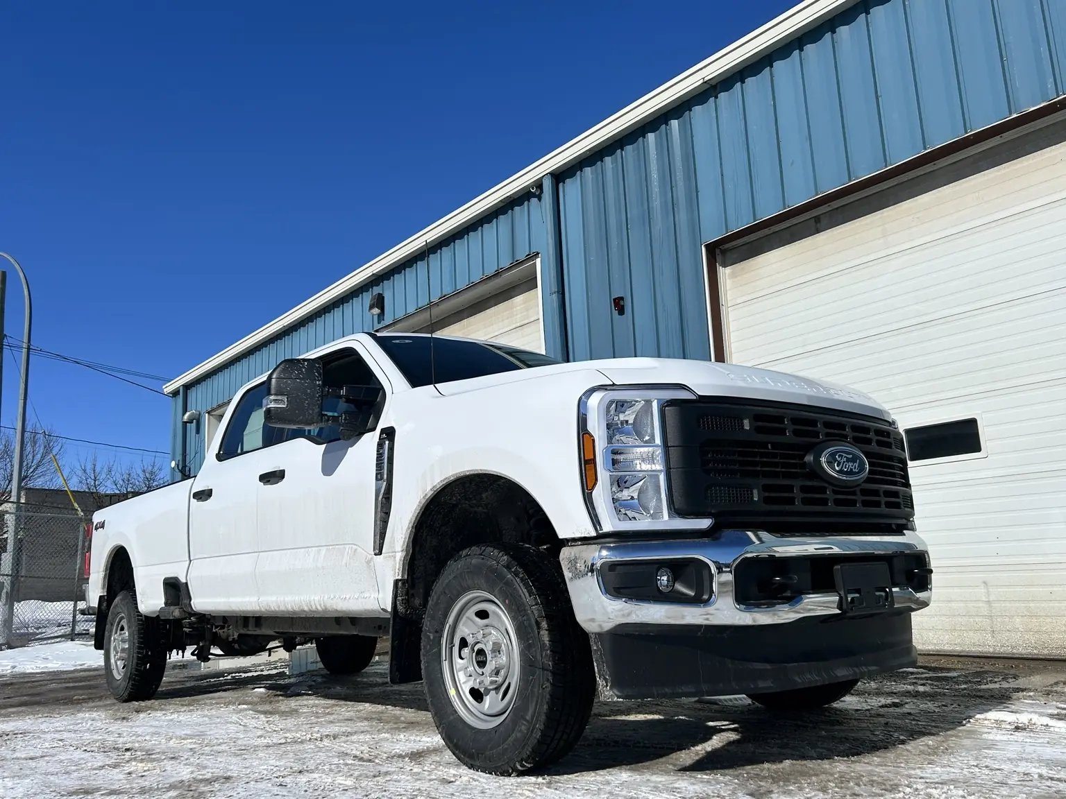 Ford Super Duty work truck outside Standard Auto Spring Works in Winnipeg