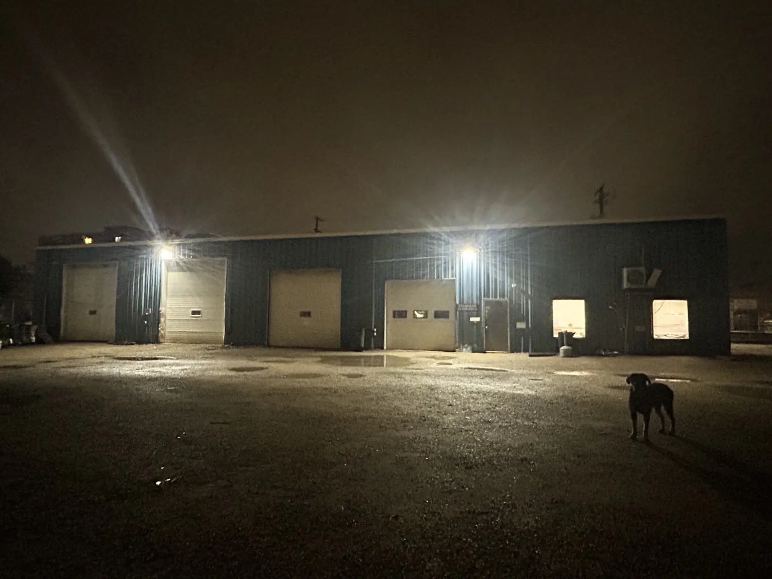 Standard Auto Spring Works service bays in Winnipeg at night