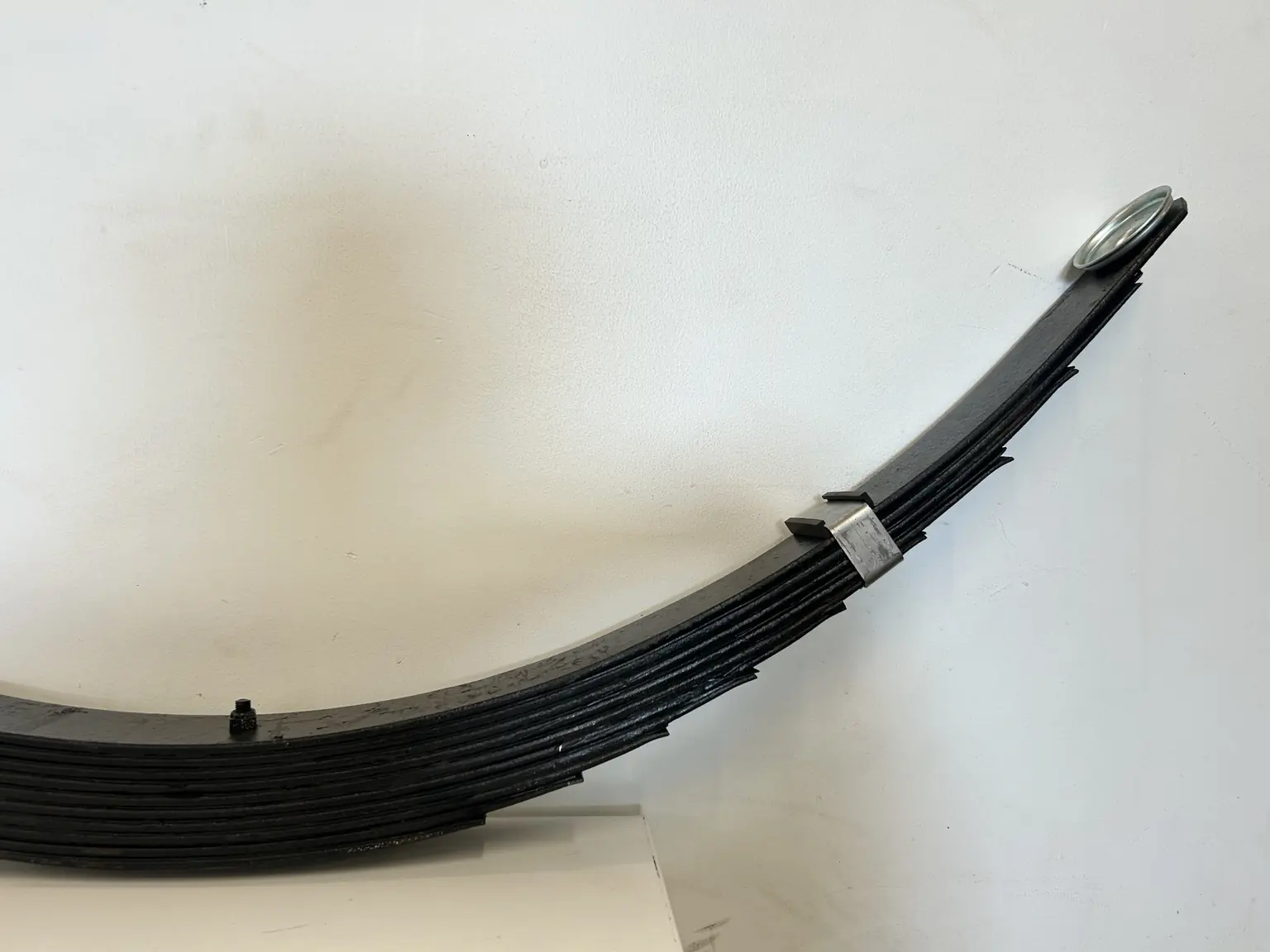 Complete multi leaf spring pack prepared for vehicle fitment