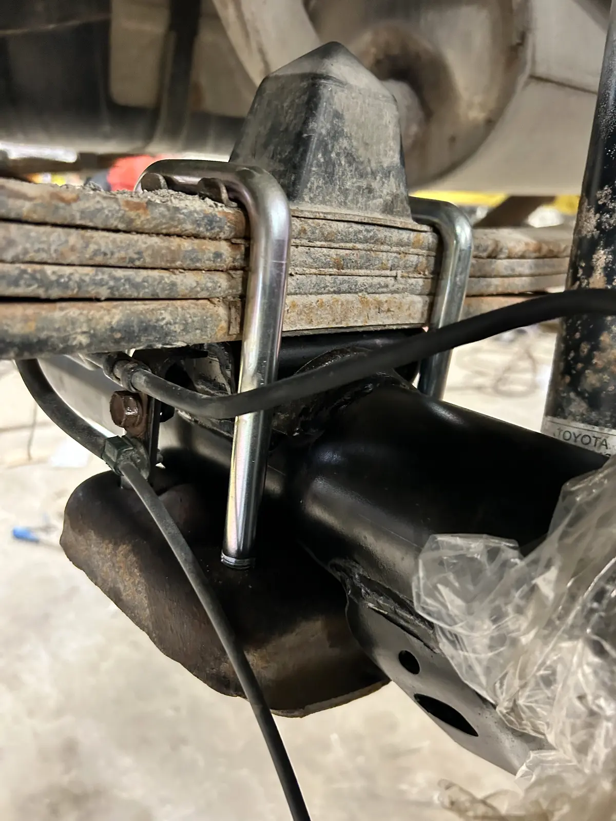U-bolts securing a leaf spring pack to an axle